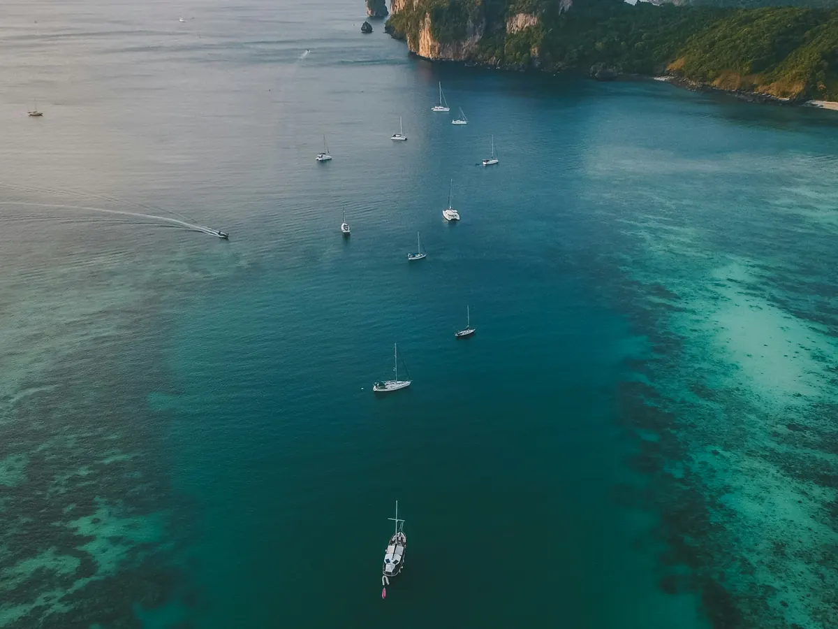 Turquoise bay with boats seen from above