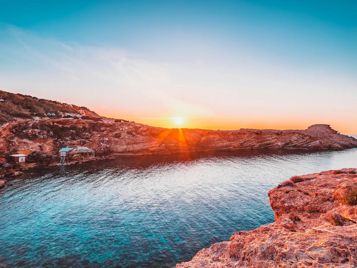 Ibiza cliffs above the sea at sunset